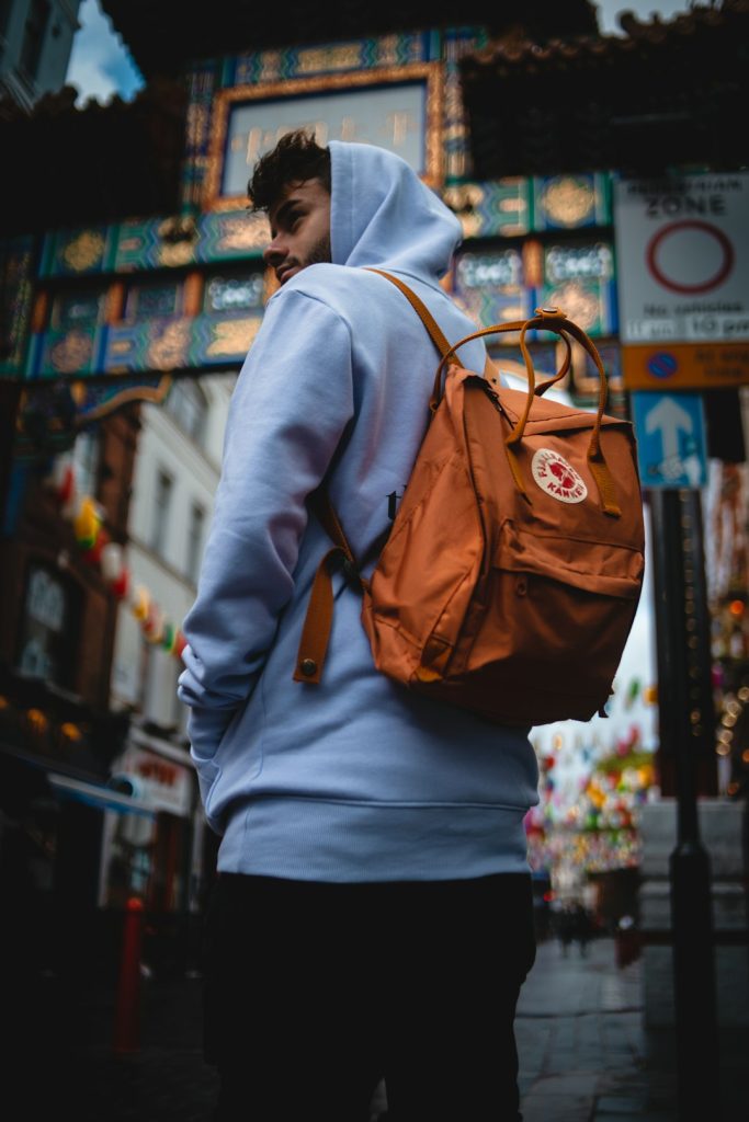 man-in-gray-hoodie-and-black-backpack-bs2ajkmjpza